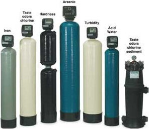 Row of water filter and softener vessels, each labelled with the contaminant it treats: iron, taste and odour, hardness, arsenic, turbidity, acid water and sediment