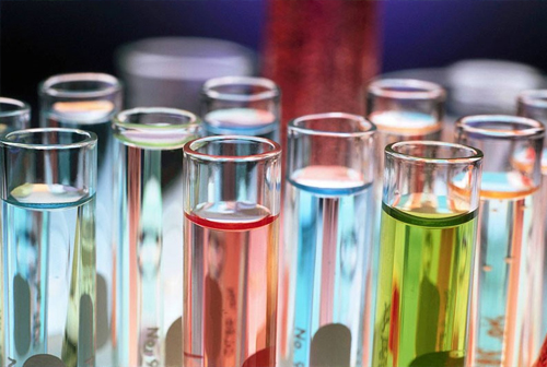 Laboratory test tubes holding coloured water treatment chemical samples